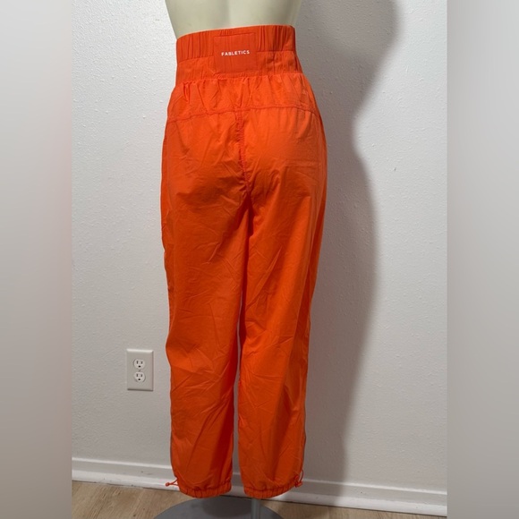 NWT Fabletics High-Waisted Piped Nylon Pant in Passion Orange - Picture 4 of 12